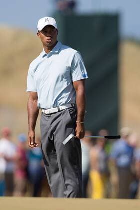 Golf - 2013 Open Championship at Muirfield - Friday Round Two Tiger Woods of USA rues a missed shot on the hole on the 5th 