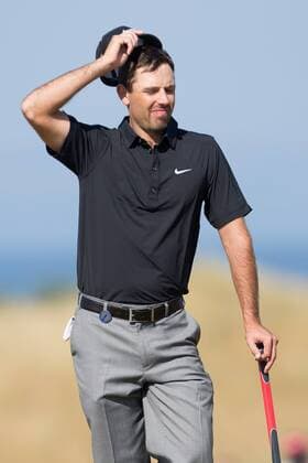 Golf - 2013 Open Championship at Muirfield - Friday Round Two Charl Schwartzel of South Africa struggles in the heat on the 5th 