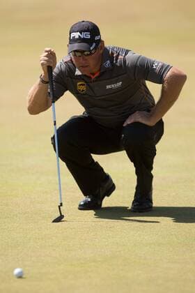 Golf - 2013 Open Championship at Muirfield - Friday Round Two Lee Westwood of England lines up a shot on the 17th green 