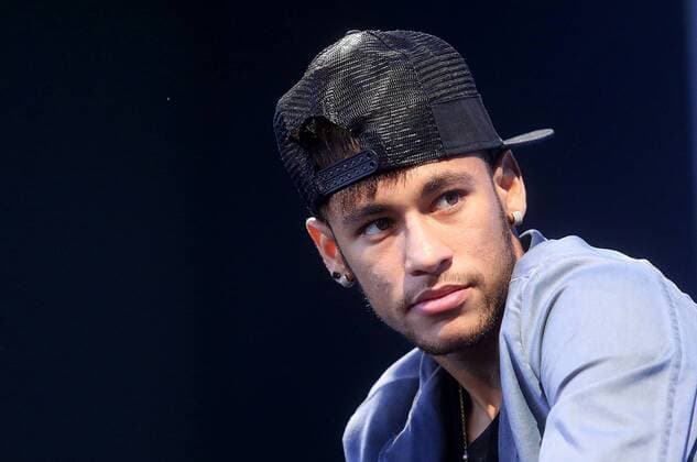Brazilian soccer player Neymar (FC Barcelona) participates in a press conference in the municipality of Santos, in the state of Sao Paulo, Brazil, on July 19, 2013. . (Xinhua Raphael Patrasso) (da) (ce) (SP)BRAZIL-SANTOS-SOCCER-NEYMAR 