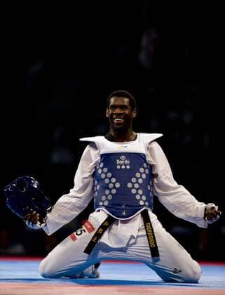 Anthony Obame of Gabon celebrates his victory in the 87kg male finals of the Taekwondo World Championship of the World Taekwondo Federation (WTF), at the Expositions and Coventions Center of Puebla, in Puebla, Mexico, on July 19, 2013. (Xinhua Guillermo Arias) (py) (SP)MEXICO-PUEBLA-TAEKWONDO-WORLD CHAMPIONSHIP 