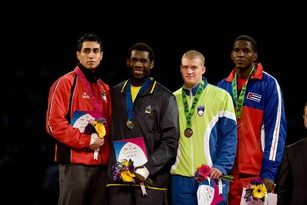 (From L to R) silver medalist Sajjad Mardani of Iran, gold medalist Anthony Obame of Gabon, bronze medalists Ivan Trajkovic of Slovenia and Robelis Despaigne of Cuba, pose during the awarding ceremony of the 87kg male final of the Taekwondo World Championship of the World Taekwondo Federation (WTF), at the Expositions and Coventions Center of Puebla, in Puebla, Mexico, on July 19, 2013. (Xinhua Guillermo Arias) (py) (SP)MEXICO-PUEBLA-TAEKWONDO-WORLD CHAMPIONSHIP 