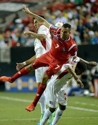 July 20, 2013 - Atlanta, GA, USA - Panama forward Blas Perez (7) battles for the ball with Cuba defender Jorge Luis Corrales (left) and Cuba midfield Alberto Gomez (20) in the first half of a Gold Cup quarterfinal at the Georgia Dome in Atlanta, Georgia, Saturday, July 20, 2013. Panama defeated Cuba, 6-1. Mexico v Trinidad Gold Cup quarterfinal - ZUMAm67