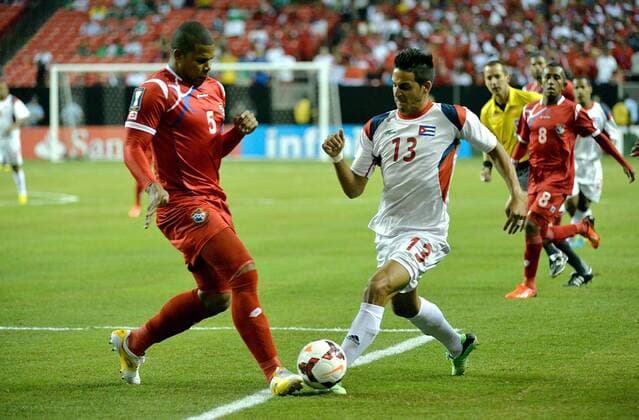 July 20, 2013 - Atlanta, GA, USA - Panama defender Roman Torres (5) and Cuba defender Jorge Luis Corrales (13) fight for the ball in the first half of the Gold Cup quarterfinal at the Georgia Dome in Atlanta, Georgia, Saturday, July 20, 2013. Panama defeated Cuba, 6-1. Mexico v Trinidad Gold Cup quarterfinal - ZUMAm67