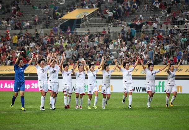 (130721) SEOUL, July 21, 2013. (Xinhua) -- Players of Democratic People s Republic of Korea (DPRK) national football team celebrate after winning a game against South Korea national football team during the EAFF Women s Asian Cup 2013 match at the Seoul World Cup Stadium in Seoul, South Korea, July 21, 2013. DPRK won the match 2-1. (Xinhua Park Jin hee) (SP)SOUTH KOREA-SEOUL-SOCCER-EAFF WOMEN S EAST ASIAN CUP 2013-DPRK VS SOUTH KOREA 