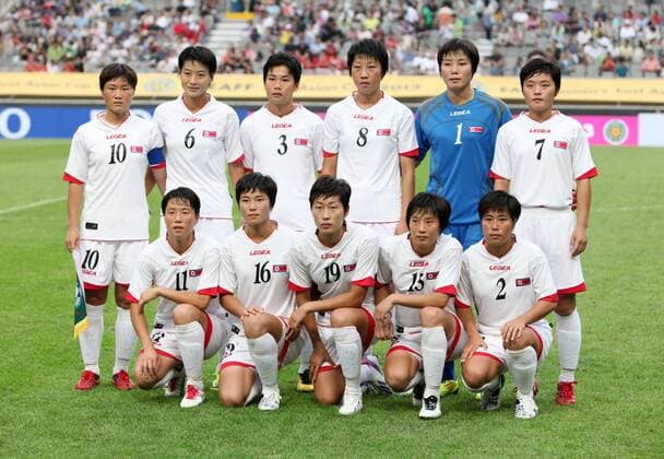 (130721) SEOUL, July 21, 2013. (Xinhua) -- Democratic People s Republic of Korea (DPRK) national football team players pose for photos (back row L-R): Ra Un Sim. Kim Un Hyang, Ho Un Byol, Kim Un Ju, Hong Myong Hui, Kim Su Gyong (front row L-R), Ri Ye Gyong, Kim Un Ha, Yun Song Mi, Kim Nam Hui, Choe Un Ju before the EAFF Women s Asian Cup 2013 match at the Seoul World Cup Stadium in Seoul, , July 21, 2013. DPRK won the match 2-1. (Xinhua Park Jin hee) (SP) SEOUL-SOCCER-EAFF WOMEN S EAST ASIAN CUP 2013-