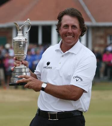 USA s Phil Mickelson holds the Claret Jug after winning the Open Championship at Muirfield on the fourth day of the 2013 Open Championship in Muirfield, Scotland on July 21 , 2013.Mickelson won with a score of three under par.  LON2013072105