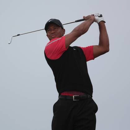 USA s Tiger Woods drives on the twelth tee on the fourth day of the 2013 Open Championship in Muirfield, Scotland on July 21 , 2013.Phil Mickelson won the championship with a score of three under par.  LON2013072111