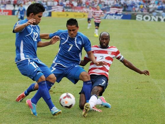 July 21, 2013 - Baltimore, MD, USA - El Salvador s Andres Flores Mejia (12) and teammate Darwin Ceren Delgado (7) battle U.S. s DaMarcus Beasley for the ball during the first half of the Gold Cup quarterfinals in Baltimore, Maryland, Sunday, July 21, 2013. U.S. wins, 5-1. El Salvador vs. USA - ZUMAm67
