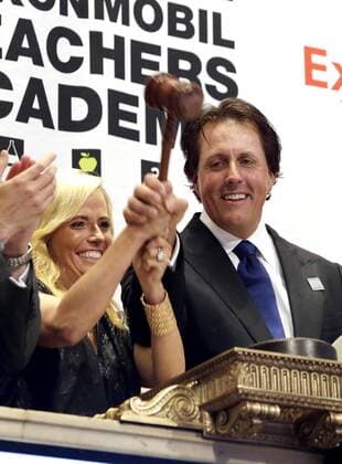Phil Mickelson, Amy Mickelson and executives from the Mickelson ExxonMobil Teachers Academy ring the closing bell at the NYSE on Wall Street In New York City on July 26, 2013. In its ninth year, the Mickelson ExxonMobil Teachers Academy is a week-long professional development program where third- through fifth-grade teachers hone their math and science skills and learn ways to excite and inspire their students in these subjects.  NYP20130726147