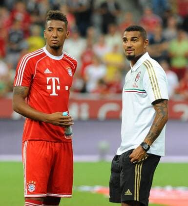 Finale Audi Cup 2013 --- FC Bayern München vs Manchester City --- Allianz Arena München, 01.08.2013 Die beiden Brüder Jerome BOATENG (FC Bayern München),links und Kevin Prince BOATENG (AC Mailand) treffen sich nach dem Finalspiel. EP_WSE