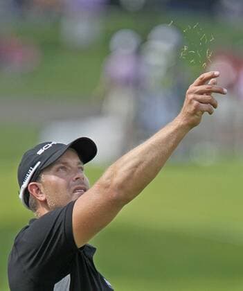 Aug. 1, 2013 - Akron, OH, USA - Henrik Stenson tests the wind on the 9th fairway during the opening round of the WGC-Bridgestone Invitational at Firestone Country Club in Akron, Ohio, on Thursday, August 1, 2013. WGC-Bridgestone Invitational - ZUMAm67