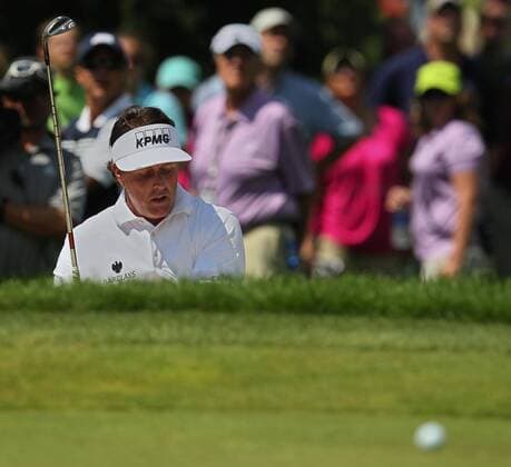 Aug. 1, 2013 - Akron, OH, USA - Phil Mickelson reacts to a poor shot out of a bunker on the 4th hole during the opening round of the WGC-Bridgestone Invitational at Firestone Country Club in Akron, Ohio, on Thursday, August 1, 2013. WGC-Bridgestone Invitational - ZUMAm67