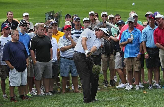 Aug. 1, 2013 - Akron, OH, USA - Phil Mickelson hits a chip shot from behind the 4th green during the opening round of the WGC-Bridgestone Invitational at Firestone Country Club in Akron, Ohio, on Thursday, August 1, 2013. WGC-Bridgestone Invitational - ZUMAm67