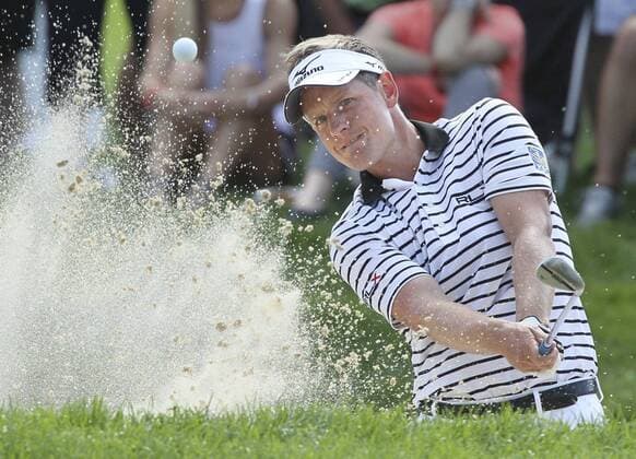 Aug. 3, 2013 - Akron, OH, USA - Luke Donald blasts out of the sand on the 15th hole during the third round of the WGC-Bridgestone Invitational at Firestone Country Club in Akron, Ohio, on Saturday, August 3, 2013. WGC-Bridgestone Invitational - ZUMAm67