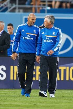 03 August 2013: Real Madrid assistant coach Zinedine Zidane talks with Real Madrid manager Carlo Ancelotti after the Guinness International Champions Cup game between Everton FC and Real Madrid at Dodger Stadium in Los Angeles, CA, USA. Real Madrid beat Everton 2-1. SOCCER: AUG 03 International Champions Cup - Everton v Real Madrid Icon130803048 EDITORIAL USE ONLY