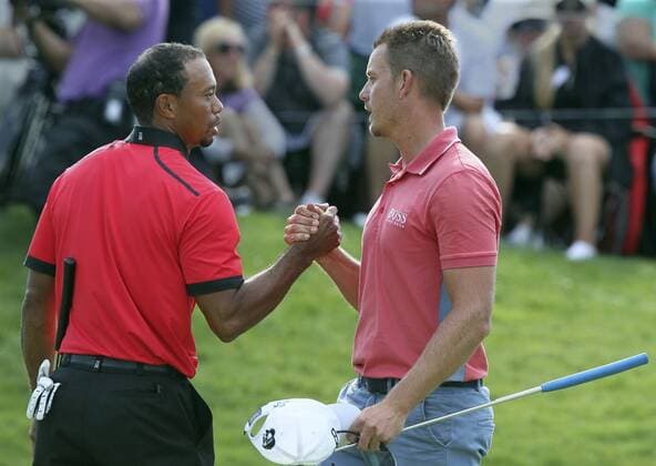 Aug. 4, 2013 - Akron, OH, USA - Tiger Woods and Henrik Stenson congratulate each other on the 18th green during the final round of the World Golf Championships Bridgestone Invitational at Firestone Country Club in Akron, Ohio, Sunday, August 4, 2013. Bridgestone Invitational final round - ZUMAm67