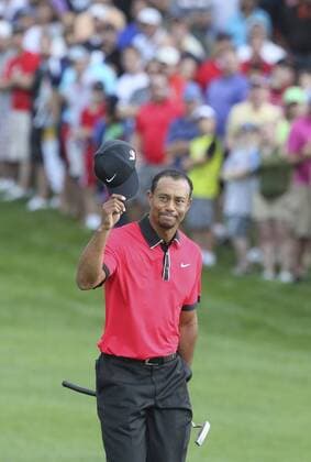 Aug. 4, 2013 - Akron, OH, USA - Tiger Woods tips his cap to a roaring crowd as he approaches the 18th green during the final round of the World Golf Championships Bridgestone Invitational at Firestone Country Club in Akron, Ohio, Sunday, August 4, 2013. Bridgestone Invitational final round - ZUMAm67