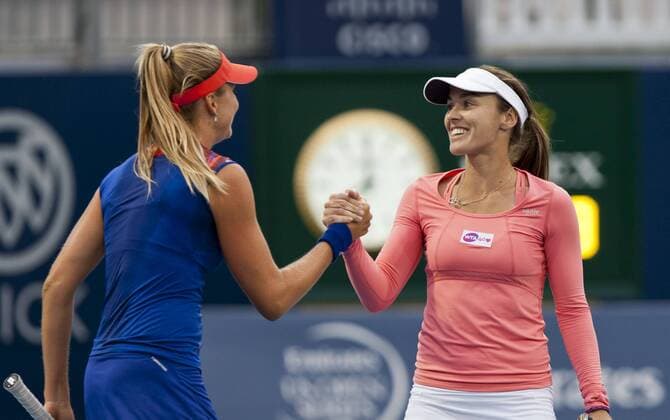 Martina Hingis (R) of Switzerland and Daniela Hantuchova of Slovakia celebrate victory after the first round of women s doubles at the 2013 Rogers Cup in Toronto, Canada, Aug. 6, 2013. (Xinhua Zou Zheng) (SP)CANADA-TORONTO-TENNIS-WTA-ROGERS CUP 