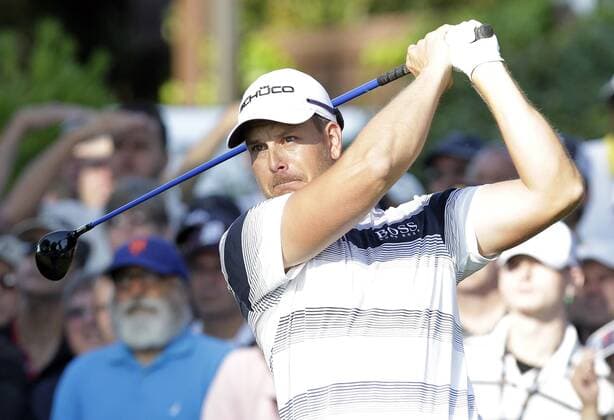 Henrik Stenson hits his tee shot on hole 10 in the first round of the PGA Golf Herren Championship at Oak Hill Country Club in Rochester, New York on August 8, 2013.  NYP20130808110