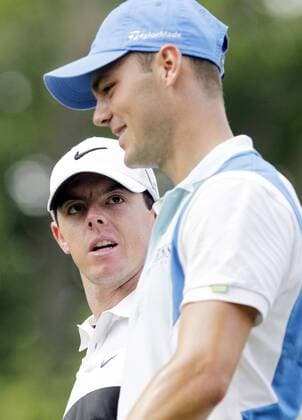 Rory McIlroy and Martin Kaymer walk up the ninth fairway in the first round of the PGA Golf Herren Championship at Oak Hill Country Club in Rochester, New York on August 8, 2013.  NYP20130808158