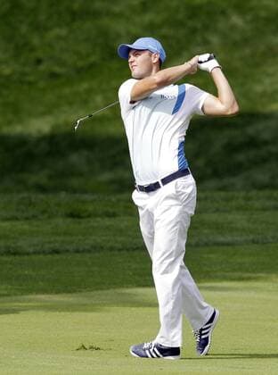 Martin Kaymer hits an iron on the the 10th hole fairway in the first round of the PGA Golf Herren Championship at Oak Hill Country Club in Rochester, New York on August 8, 2013.  NYP20130808157
