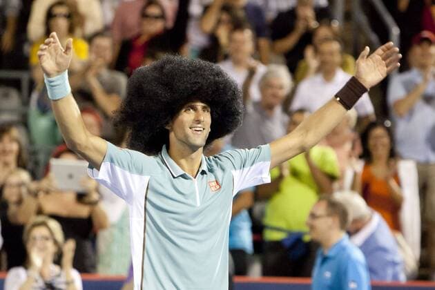 Aug. 08, 2013 - Montreal, Quebec, CAN - Novak Djokovic (SRB) wins his evening match during day 4 action and celebrates with a large wig and some dancing on centre court. Tennis 2013 - Rogers Cup - AUG 08 - ZUMAs30
