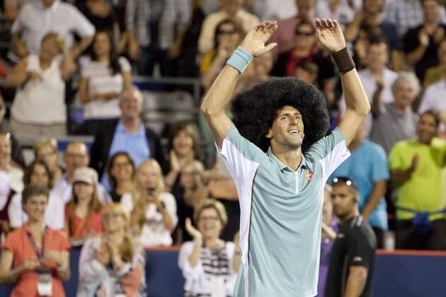 Aug. 08, 2013 - Montreal, Quebec, CAN - Novak Djokovic (SRB) wins his evening match during day 4 action and celebrates with a large wig and some dancing on centre court. Tennis 2013 - Rogers Cup - AUG 08 - ZUMAs30