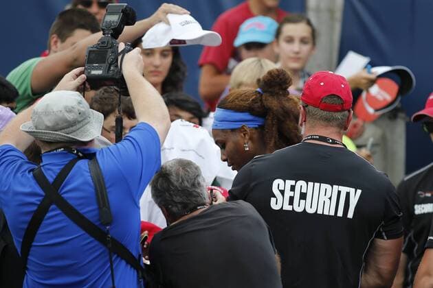 Toronto, Ontario, Canada - Security, fans and media surround SERENA WILLIAMS during an impromptu autograph session on Day 6 at the Rogers Cup Women s tennis tournament in Toronto. Tennis 2013 - Rogers Cup - Day 6 - ZUMAs10