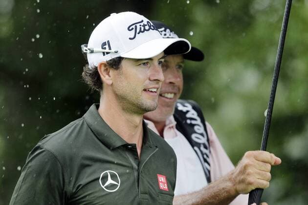 Adam Scott and caddie Steve Williams walk to the 15th green in the second round of the PGA Golf Herren Championship at Oak Hill Country Club in Rochester, New York on August 9, 2013.  NYP20130809110