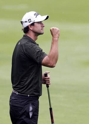 Adam Scott reacts after making a birdie putt on the 13th hole in the second round of the PGA Golf Herren Championship at Oak Hill Country Club in Rochester, New York on August 9, 2013.  NYP20130809121