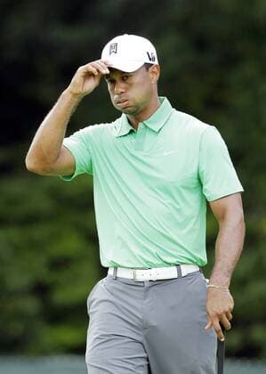 Tiger Woods reacts after missing a putt for birdie on the 8th hole in the second round of the PGA Golf Herren Championship at Oak Hill Country Club in Rochester, New York on August 9, 2013.  NYP20130809160