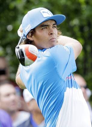 Rickie Fowler hits his tee shot on the 9th hole in the second round of the PGA Golf Herren Championship at Oak Hill Country Club in Rochester, New York on August 9, 2013.  NYP20130809161