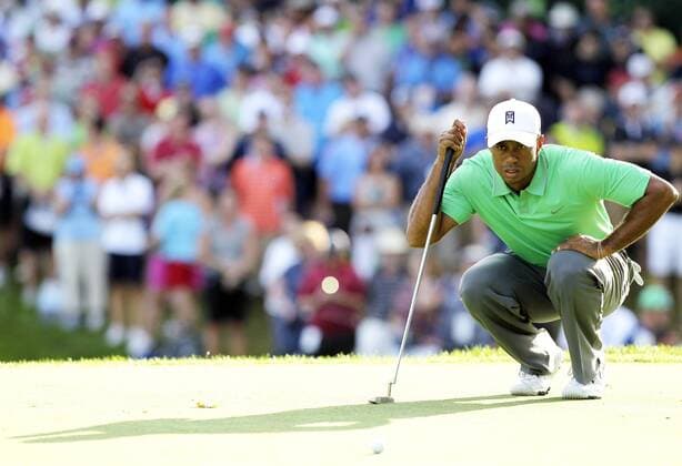Tiger Woods lines up a putt on the 18th hole in the second round of the PGA Golf Herren Championship at Oak Hill Country Club in Rochester, New York on August 9, 2013.  NYP20130809165