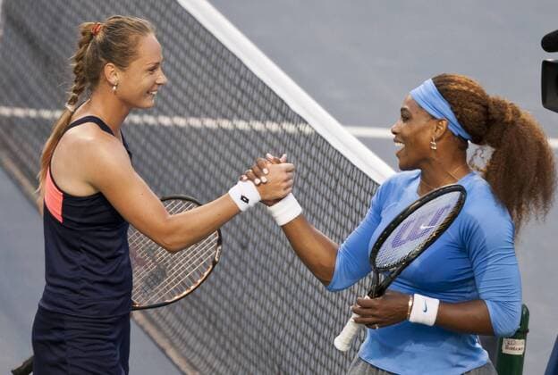 Magdalena Rybarikova of Slovakia (L) and Serena Williams of the United States greet each other after the quarterfinals of women s singles at the 2013 Rogers Cup in Toronto, Canada, Aug. 9, 2013. (Xinhua Zou Zheng) (SP)CANADA-TORONTO-TENNIS-WTA-ROGERS CUP-QUARTERFINAL 