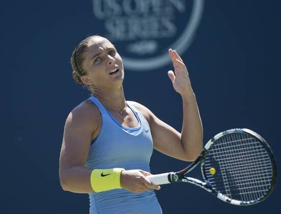 Sara Errani of Italy reacts during the quarterfinal of women s singles at the 2013 Rogers Cup in Toronto, Canada, Aug. 9, 2013. (Xinhua Zou Zheng) (SP)CANADA-TORONTO-TENNIS-WTA-ROGERS CUP-QUARTERFINAL 