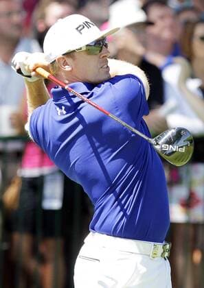 Hunter Mahan hits a tee shot on the 14th hole in the third round of the PGA Golf Herren Championship at Oak Hill Country Club in Rochester, New York on August 10, 2013.  NYP20130810102