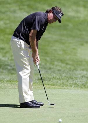 Phil Mickelson watches his putt on the 13th hole in the third round of the PGA Golf Herren Championship at Oak Hill Country Club in Rochester, New York on August 10, 2013.  NYP20130810106