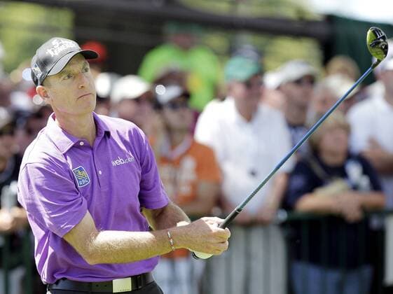 Jim Furyk tees off on the 1st hole in the third round of the PGA Golf Herren Championship at Oak Hill Country Club in Rochester, New York on August 10, 2013.  NYP20130810121