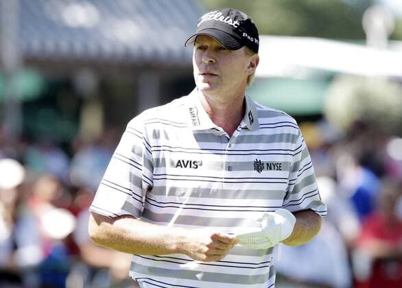 Steve Stricker walks to the fairway after he hits a tee shot on the 1st hole in the third round of the PGA Golf Herren Championship at Oak Hill Country Club in Rochester, New York on August 10, 2013.  NYP20130810128