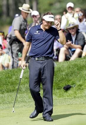 Phil Mickelson reacts before putting on the 18th green in the final round of the PGA Golf Herren Championship at Oak Hill Country Club in Rochester, New York on August 11, 2013.  NYP20130811103