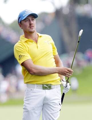 Jonas Blixt hits an approach shot to the first hole green in the final round of the PGA Golf Herren Championship at Oak Hill Country Club in Rochester, New York on August 11, 2013.  NYP20130811118