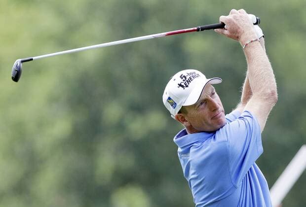 Jim Furyk hits his tee shot on the 2nd hole in the final round of the PGA Golf Herren Championship at Oak Hill Country Club in Rochester, New York on August 11, 2013.  NYP20130811122