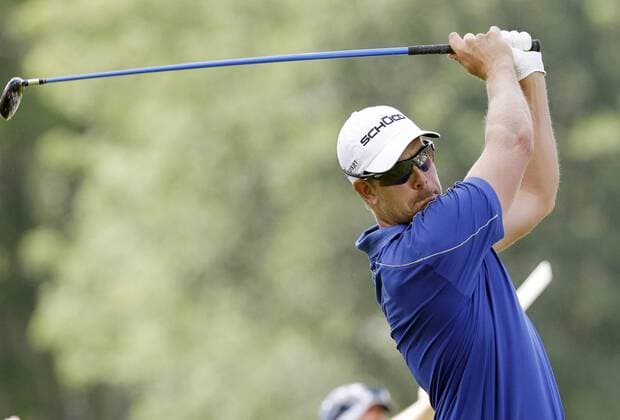 Henrik Stenson his tee shot on the 2nd hole in the final round of the PGA Golf Herren Championship at Oak Hill Country Club in Rochester, New York on August 11, 2013.  NYP20130811120