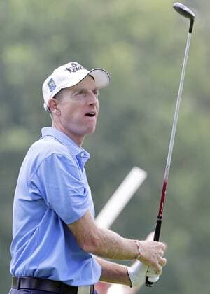 Jim Furyk watches his tee shot on the 2nd hole in the final round of the PGA Golf Herren Championship at Oak Hill Country Club in Rochester, New York on August 11, 2013.  NYP20130811123
