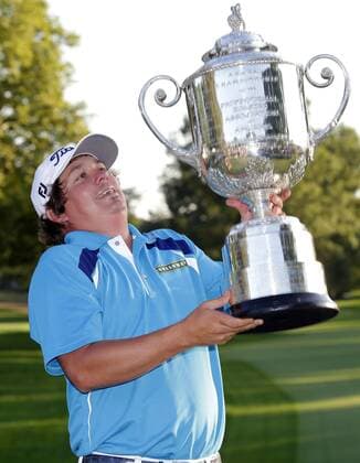 Jason Dufner holds the Wanamaker Trophy after the final round of the PGA Golf Herren Championship at Oak Hill Country Club in Rochester, New York on August 11, 2013. Dufner won the 2013 PGA Golf Herren Championship with a score of 10 under par.  NYP20130811127