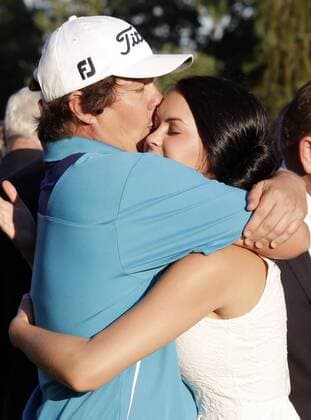 Jason Dufner kisses his wife Amanda Boyd after the final round of the PGA Golf Herren Championship at Oak Hill Country Club in Rochester, New York on August 11, 2013. Dufner won the 2013 PGA Golf Herren Championship with a score of 10 under par.  NYP20130811128