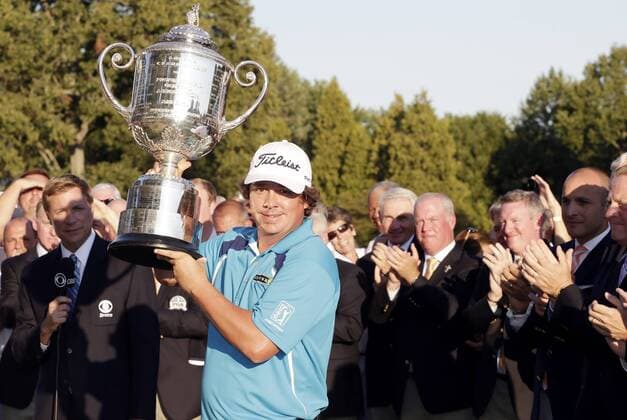 Jason Dufner holds the Wanamaker Trophy after the final round of the PGA Golf Herren Championship at Oak Hill Country Club in Rochester, New York on August 11, 2013. Dufner won the 2013 PGA Golf Herren Championship with a score of 10 under par.  NYP20130811129