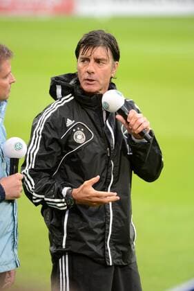 12.08.2013 , Mainz, Coface-Arena , Öffentliches Training der Deutschen Nationalmannschaft unter dem Motto DFB hautnah auch bei strömendem Regen Aktion, Einzelbild Bundestrainer Joachim Löw (DFB) nass aber glücklich