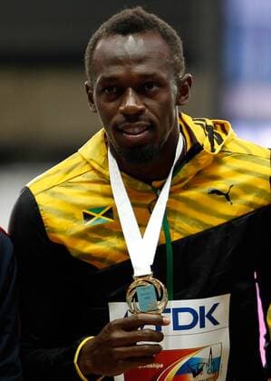 LEICHTATHLETIK - IAAF WM 2013 MOSKAU,RUSSLAND,12.AUG.13 - DIVERS, LEICHTATHLETIK - IAAF Weltmeisterschaften 2013, 100m der Herren, Siegerehrung. Bild zeigt Usain Bolt (JAM). Keywords: Medaille. 